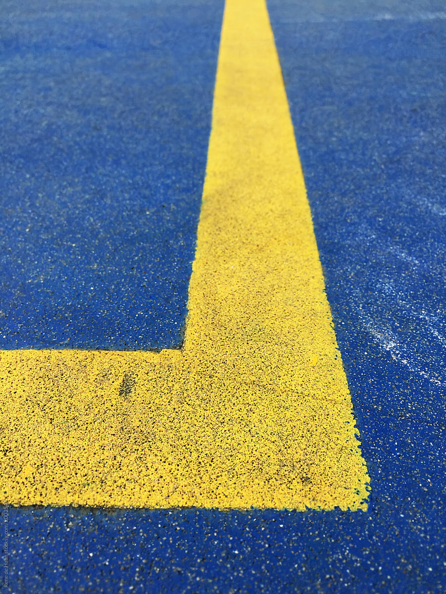 yellow line on blue floor