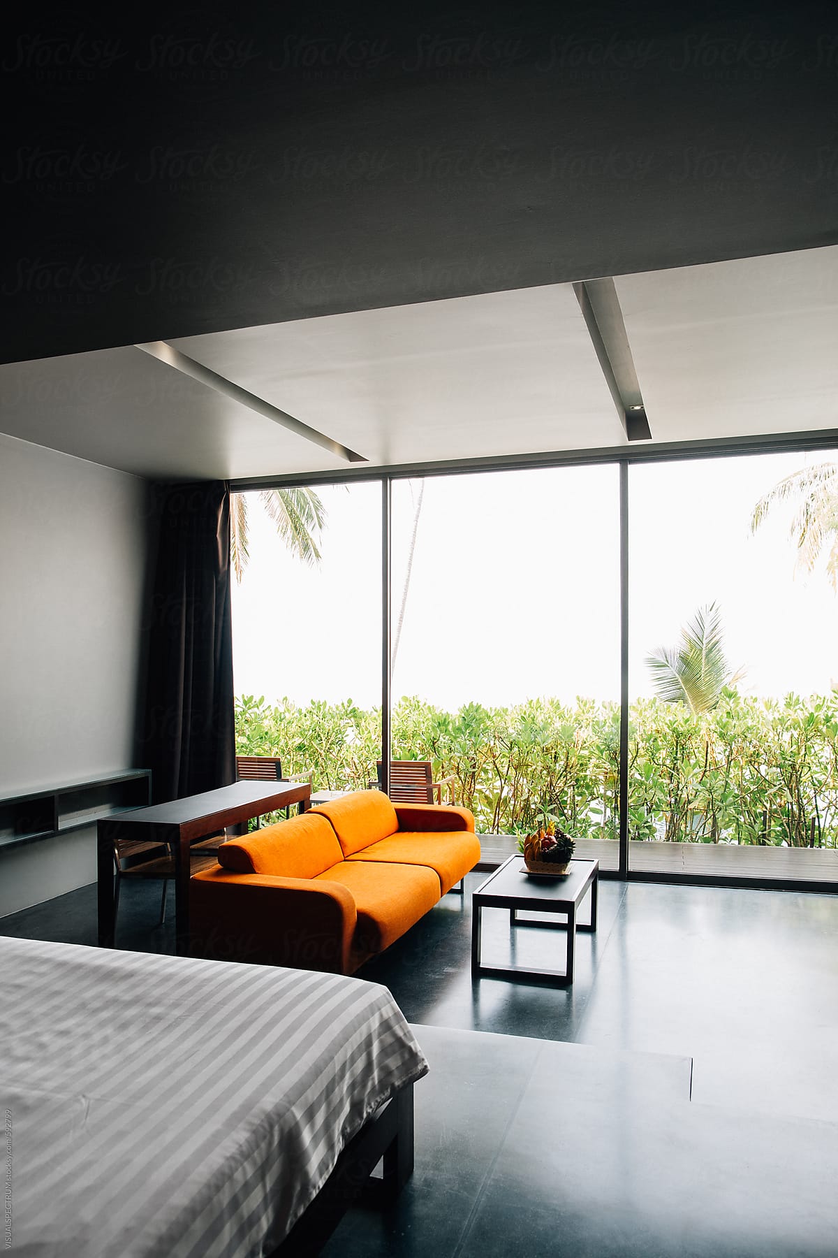 Orange Couch in Hotel Master Bedroom