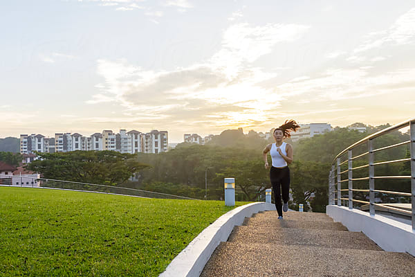 Portrait of an Asian Woman with Sportswear Sitting on the Balcony Against  City Skyline Stock Photo - Image of female, balcony: 230647946