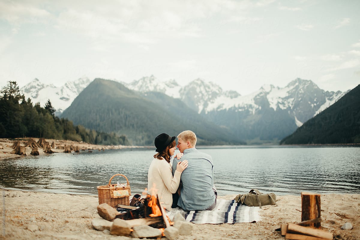 Young Couple Camping By The Fire By Stocksy Contributor Luke Liable Stocksy 