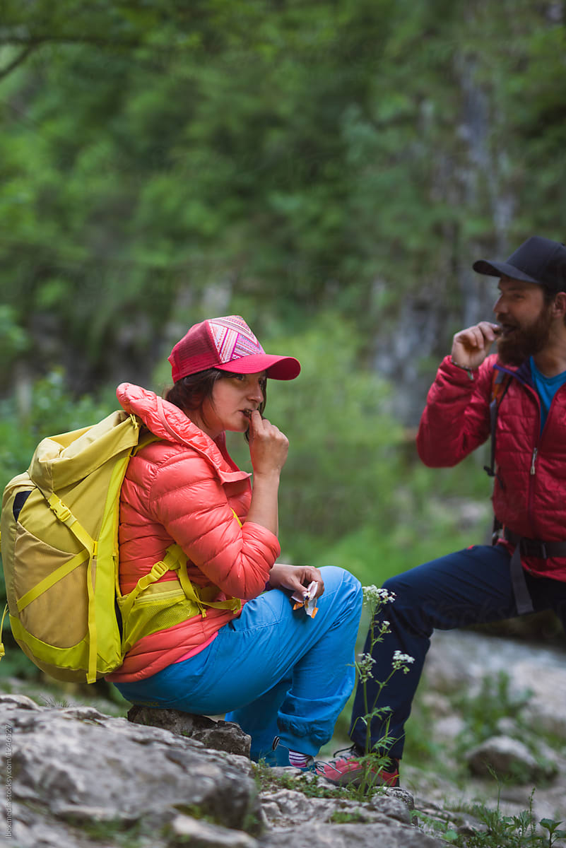 Hikers having a snack during their trip thorugh nature