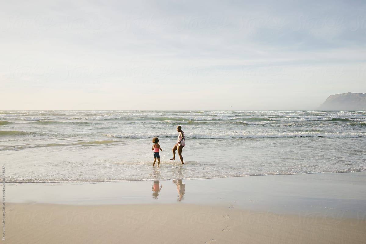 Mother And Daughter Playing At The Beach Del Colaborador De Stocksy Bruce And Rebecca 7170