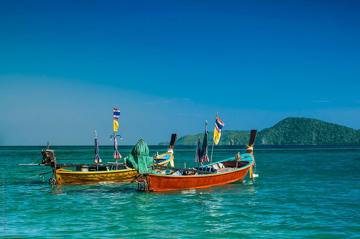 Premium Photo  Thai fishing boat used as a vehicle for finding fish in the  sea