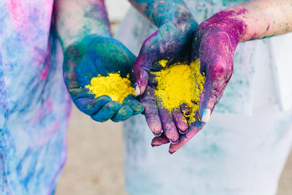 hands holding paint powder for Holi
