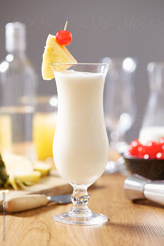 Tasty pina colada cocktail made of coconut milk,pineapple juice and rum on table