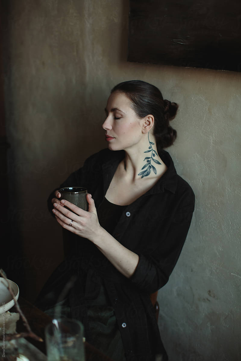 Young woman with a tattoo on her neck