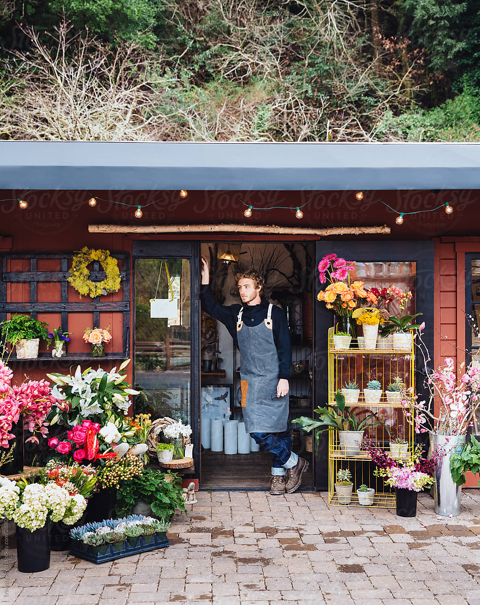 Flower shop staff standing in doorway