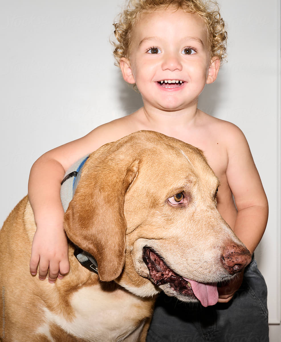 Confident Happy Little boy with his pet dog