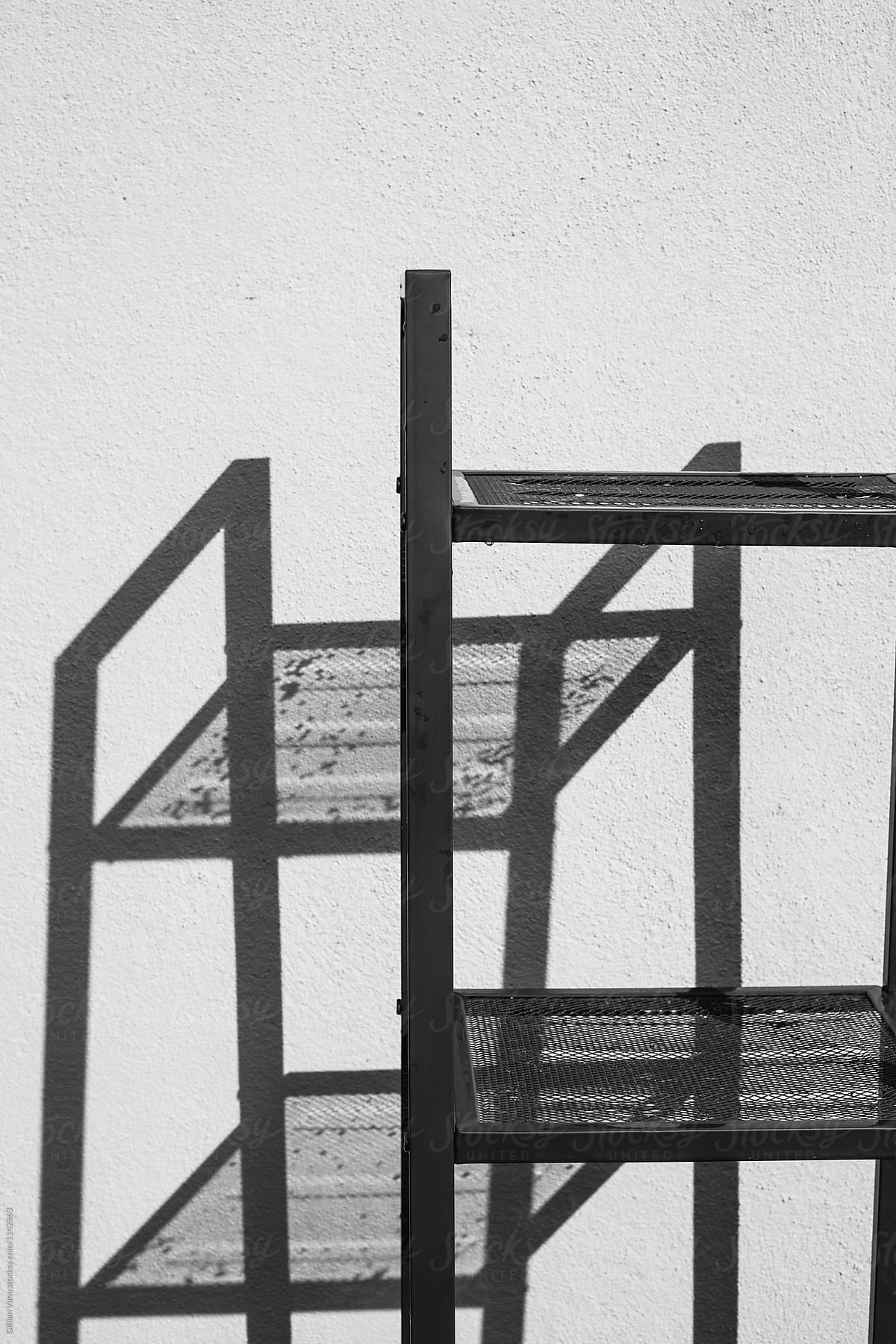 shadow abstract of a black mesh shelving unit