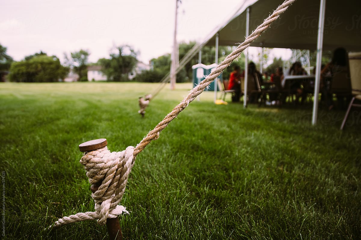 Fastened Tent Peg and Rope at an Outdoor Summer Festival