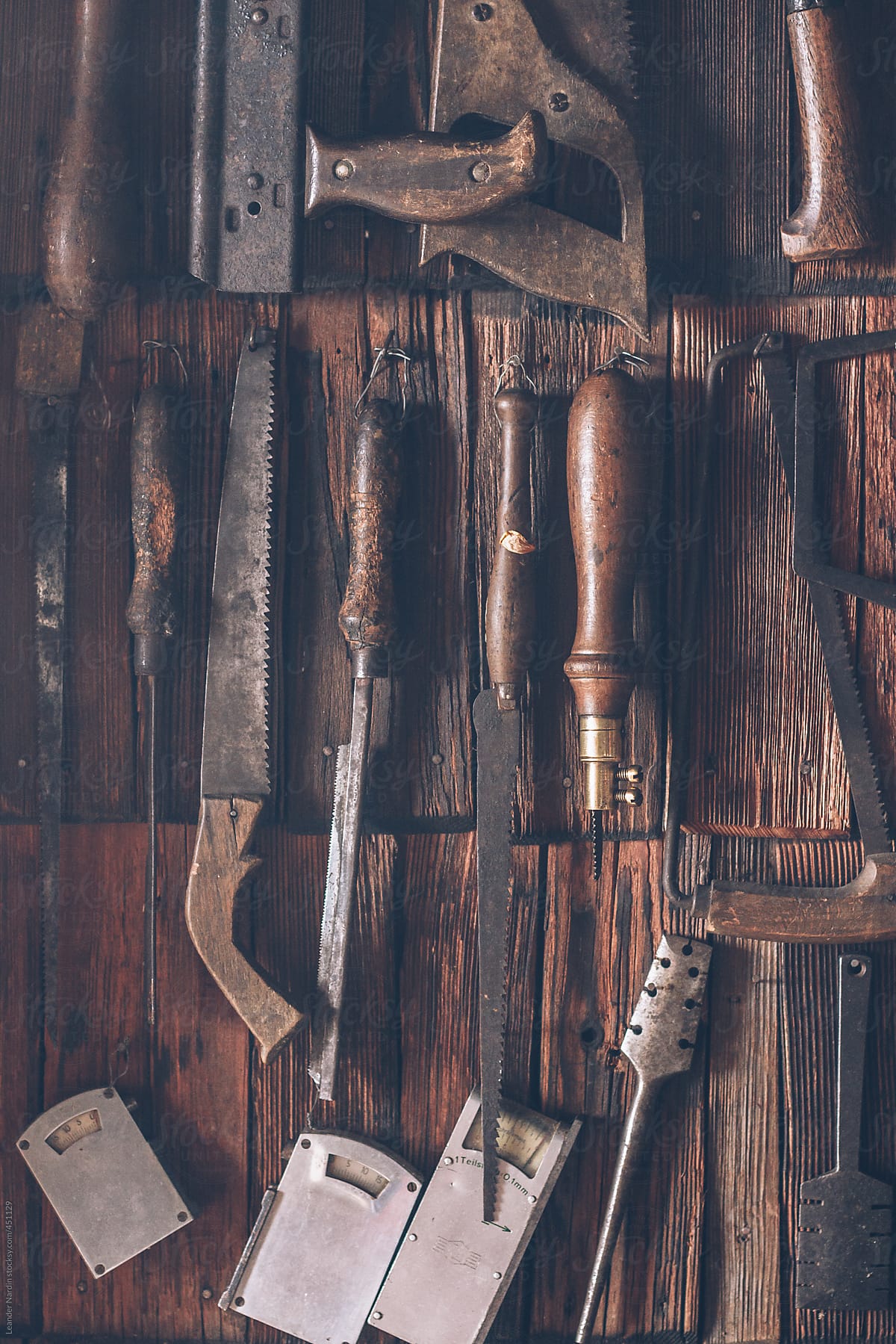different kind of tools on wooden shingle background