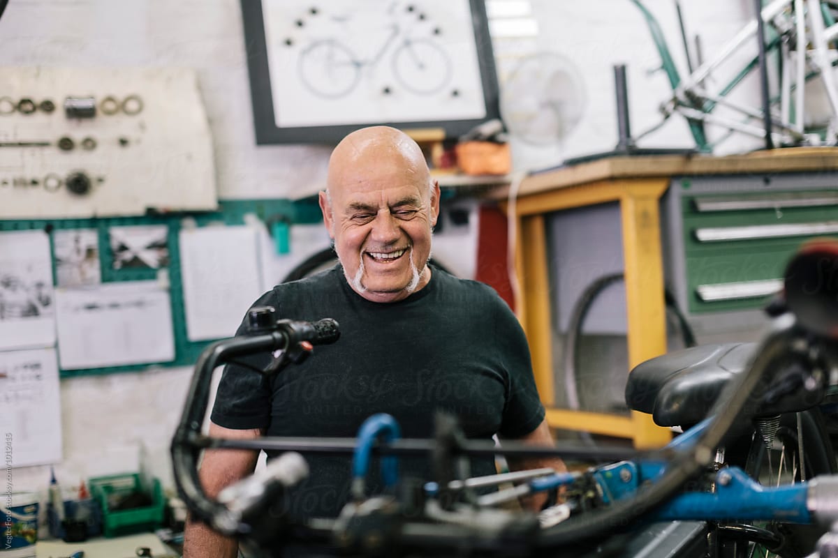 Smiling senior Bicycle Mechanic