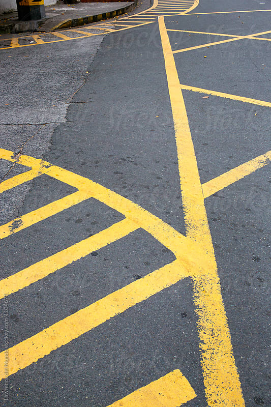 Yellow painted road markings on an intersection.