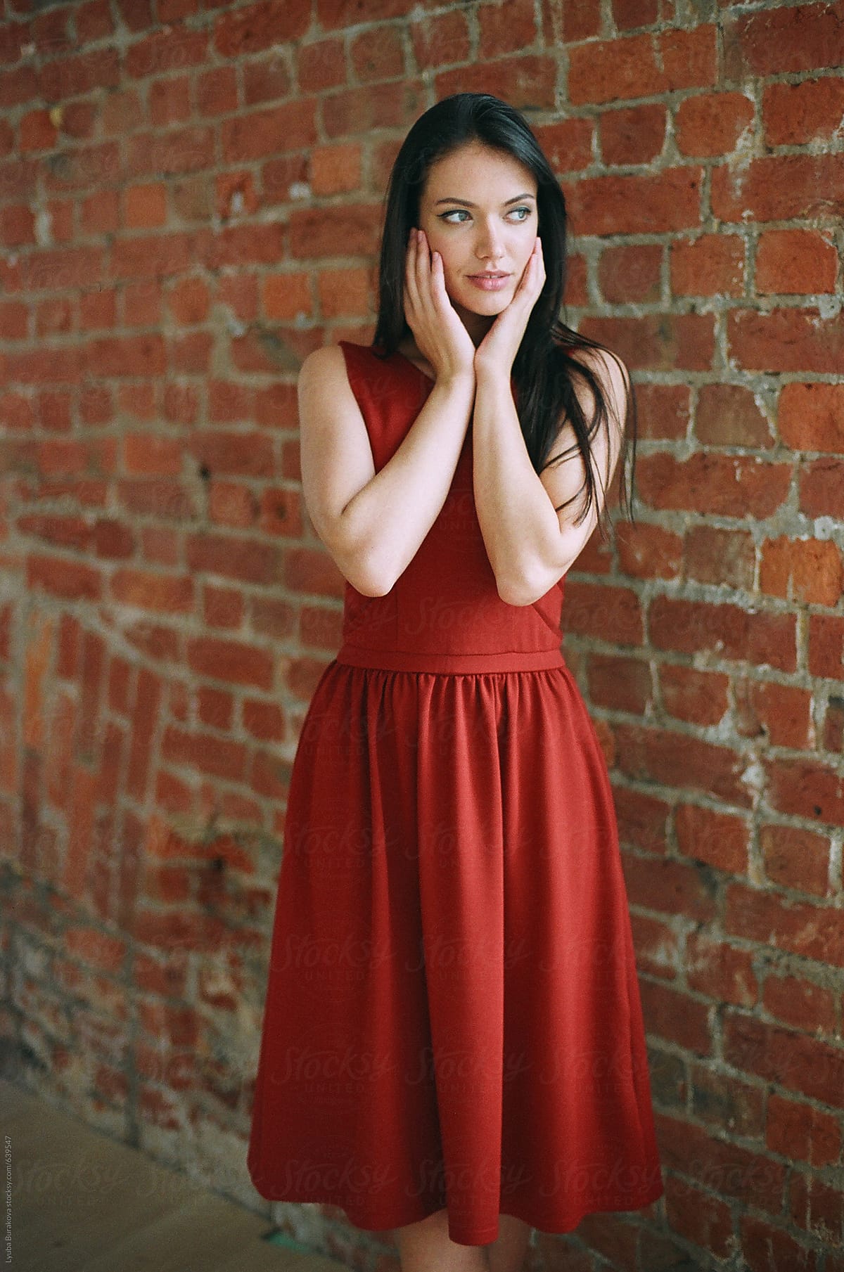 Beautiful Woman Against Brick Wall By Stocksy Contributor Amor Burakova Stocksy 