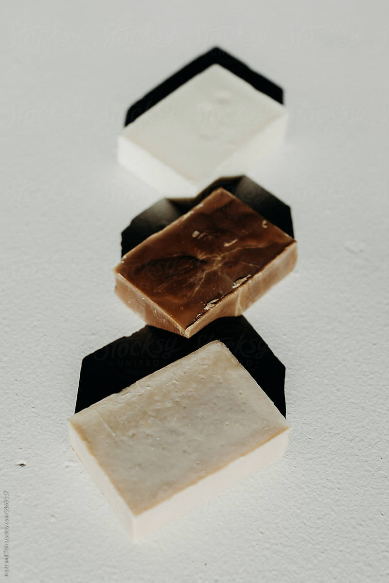 Minimal Still Life of Three Bars of Natural Soap on Cement Background