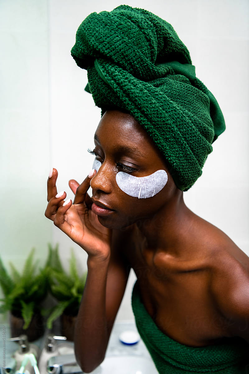 Woman applying eye mask