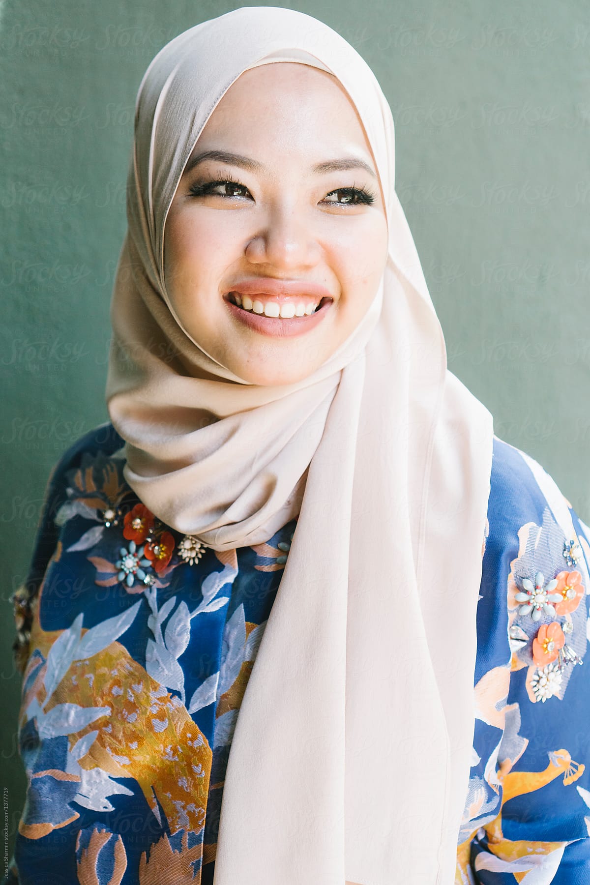 portrait of young malaysian woman by Jessica Lia  Stocksy United