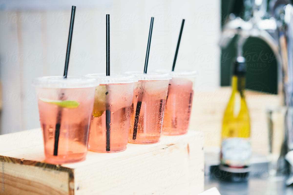 Rose wine spritzers with drinking straws