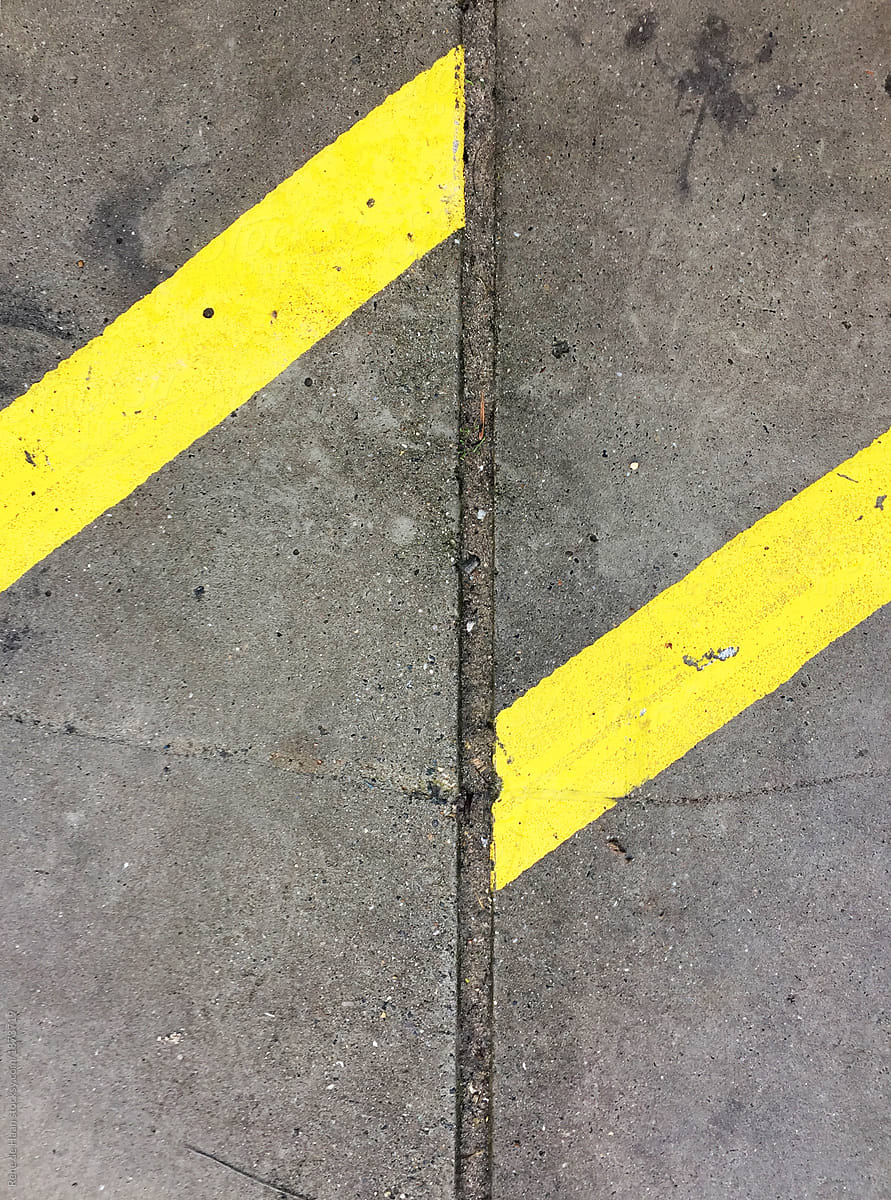 concrete pavement with two yellow lines