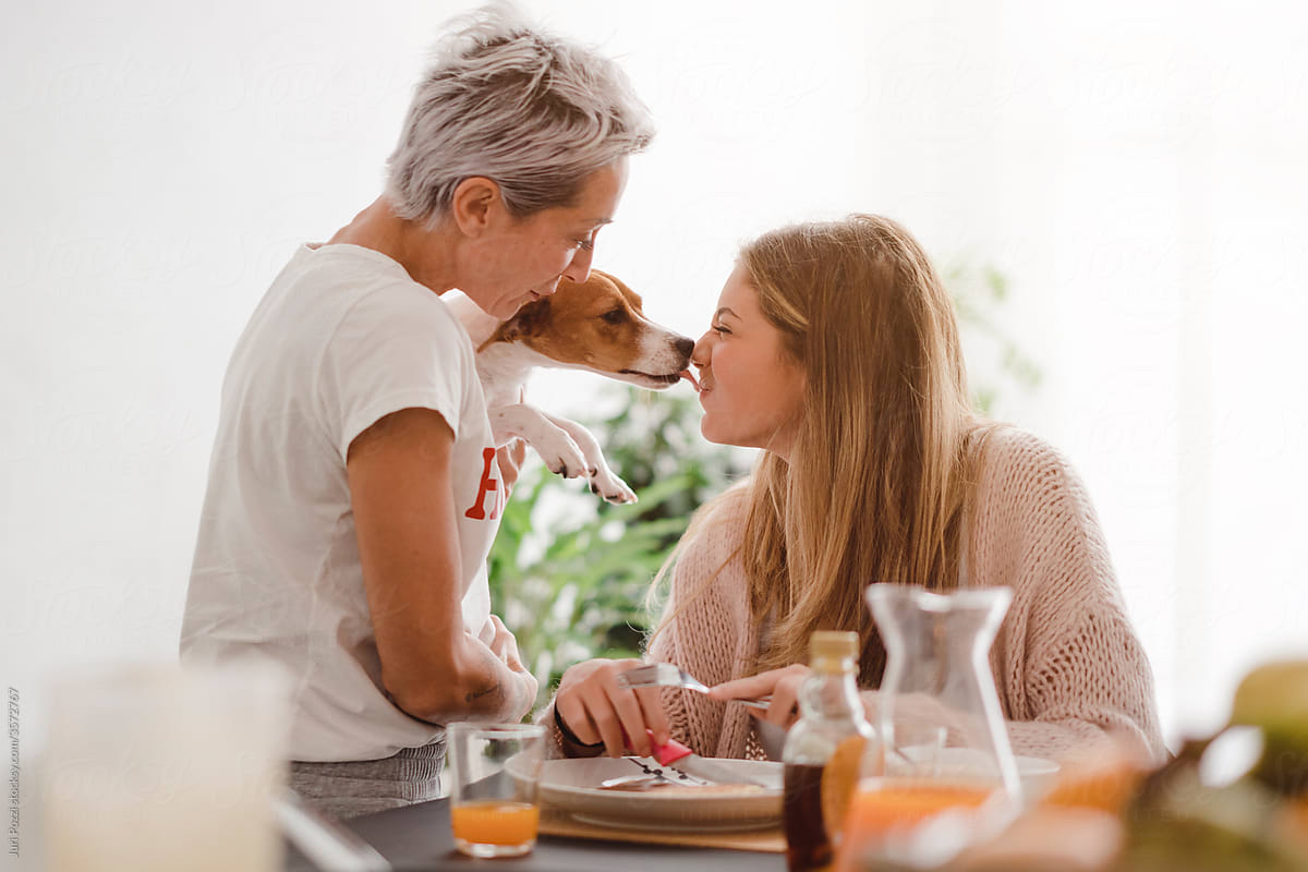 Loving mother and daughter with cute dog