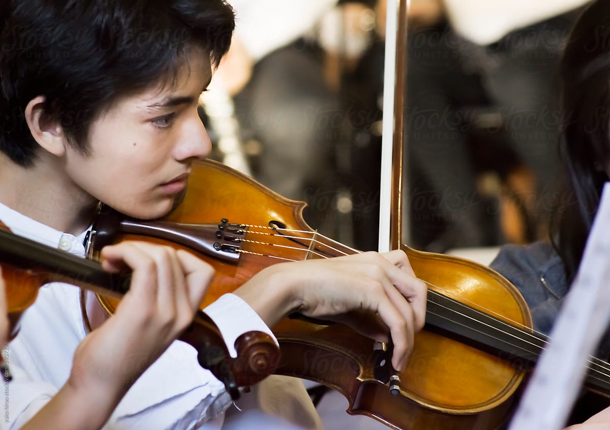 Asian teenage boy, playing the viola