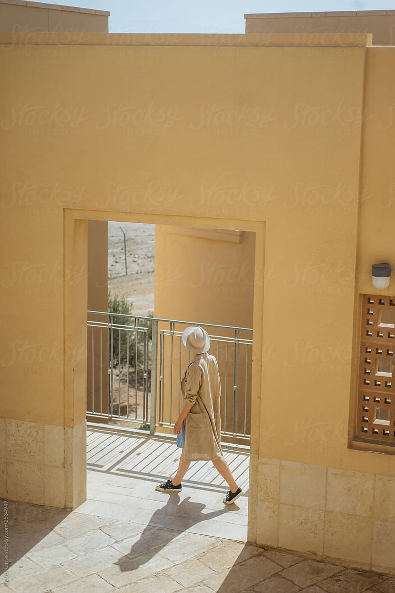 Unrecognizable woman walking on terrace