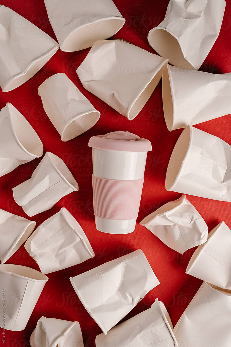 Disposable cups around reusable mug