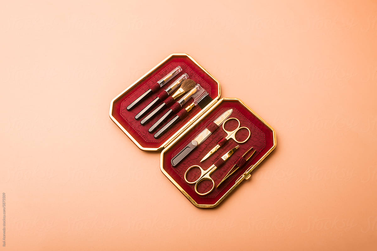 Elegant personal care tools in golden red velvet case