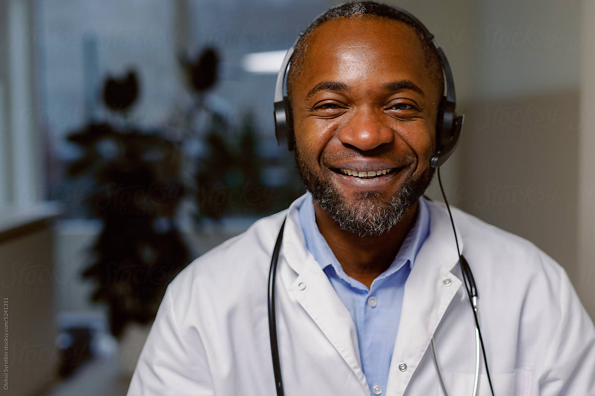 Joyful physician headset clinic consult