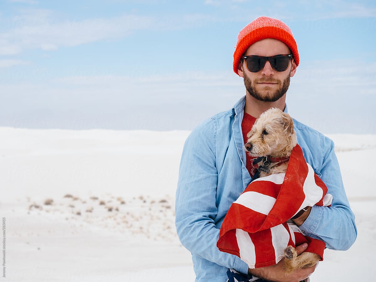 Man with Dog and American Flag in Sand Dunes