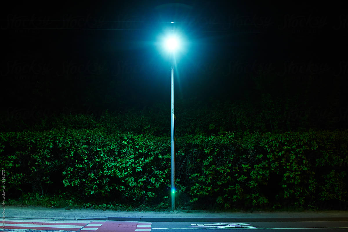 empty road with bright lantern at night