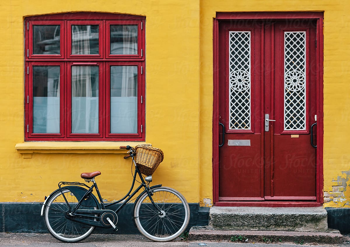 Bike parked near the yellow house