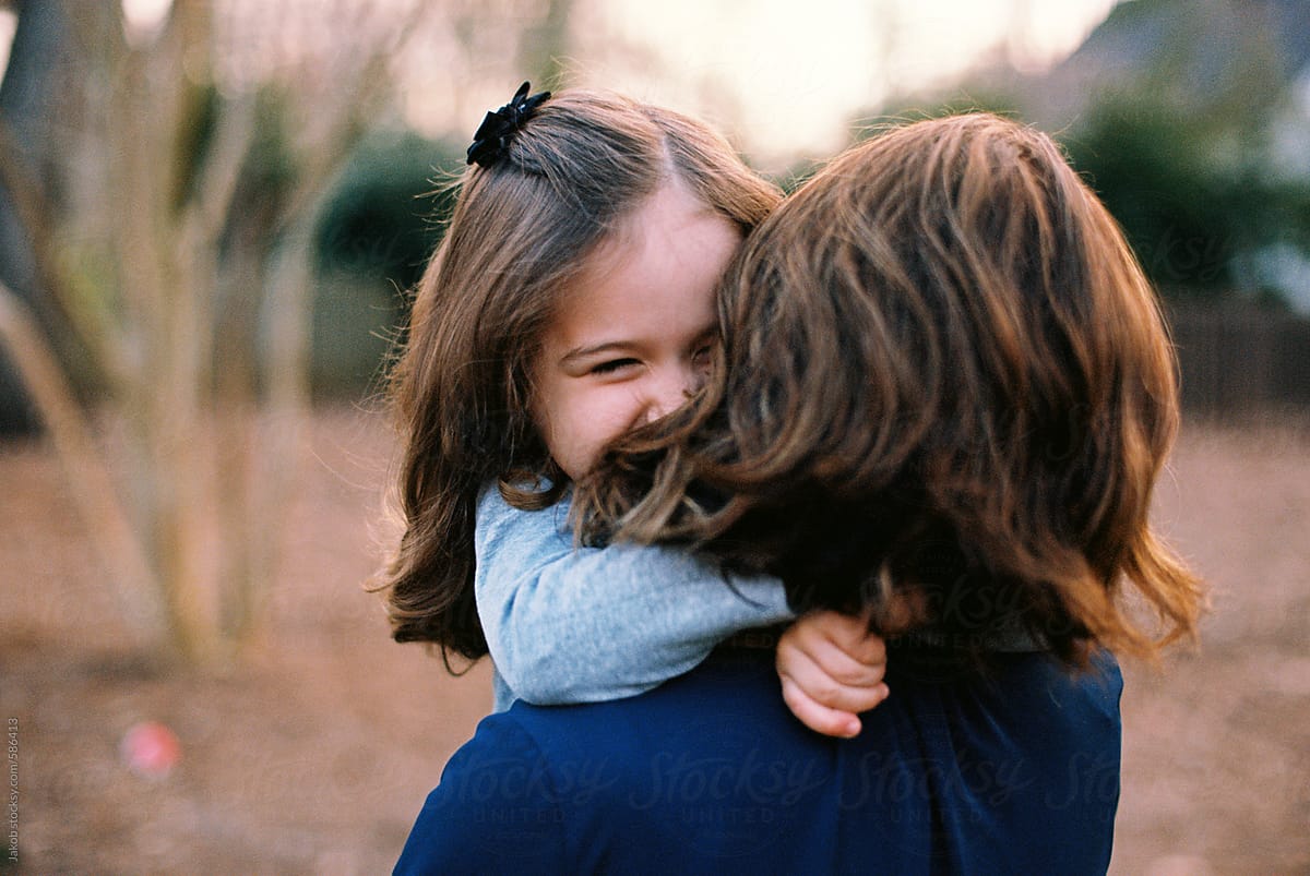 Mother And Daughter Holding Each Other And Smiling Del Colaborador De Stocksy Jakob 