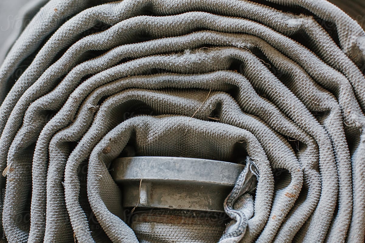 Wrapped old fire hoses on the floor