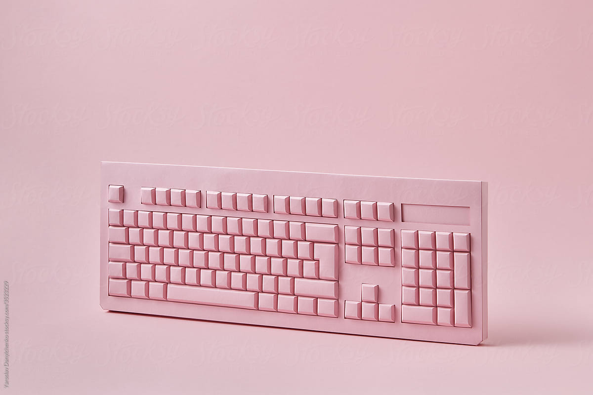 Vertically standing papercraft pink keyboard.