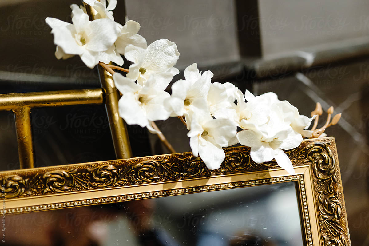 Golden mirror with flower