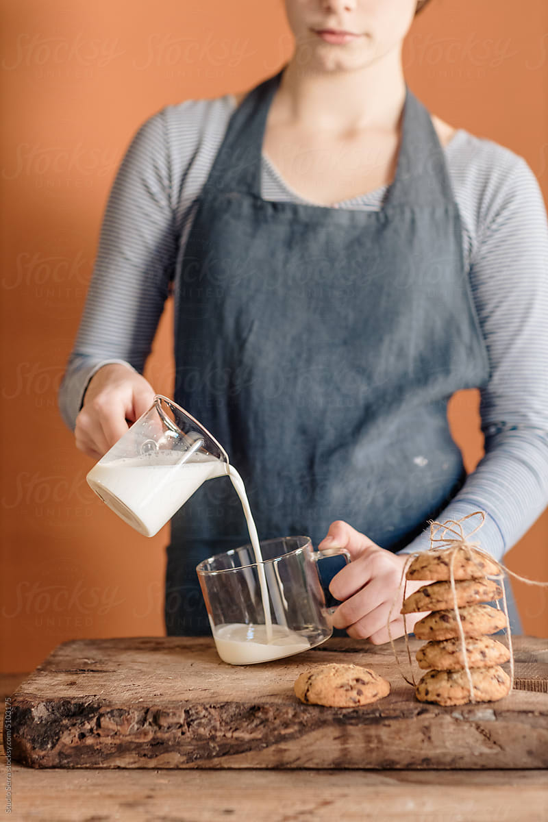 Girl Pouring Milk