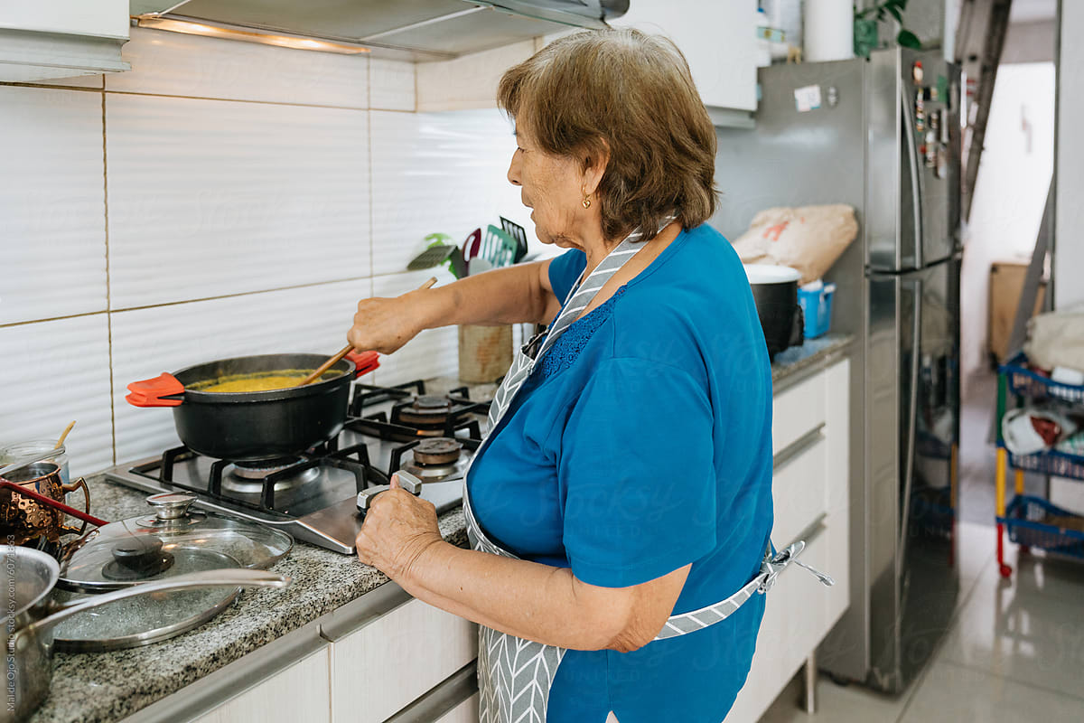 Senior Woman Cooking in Kitchen