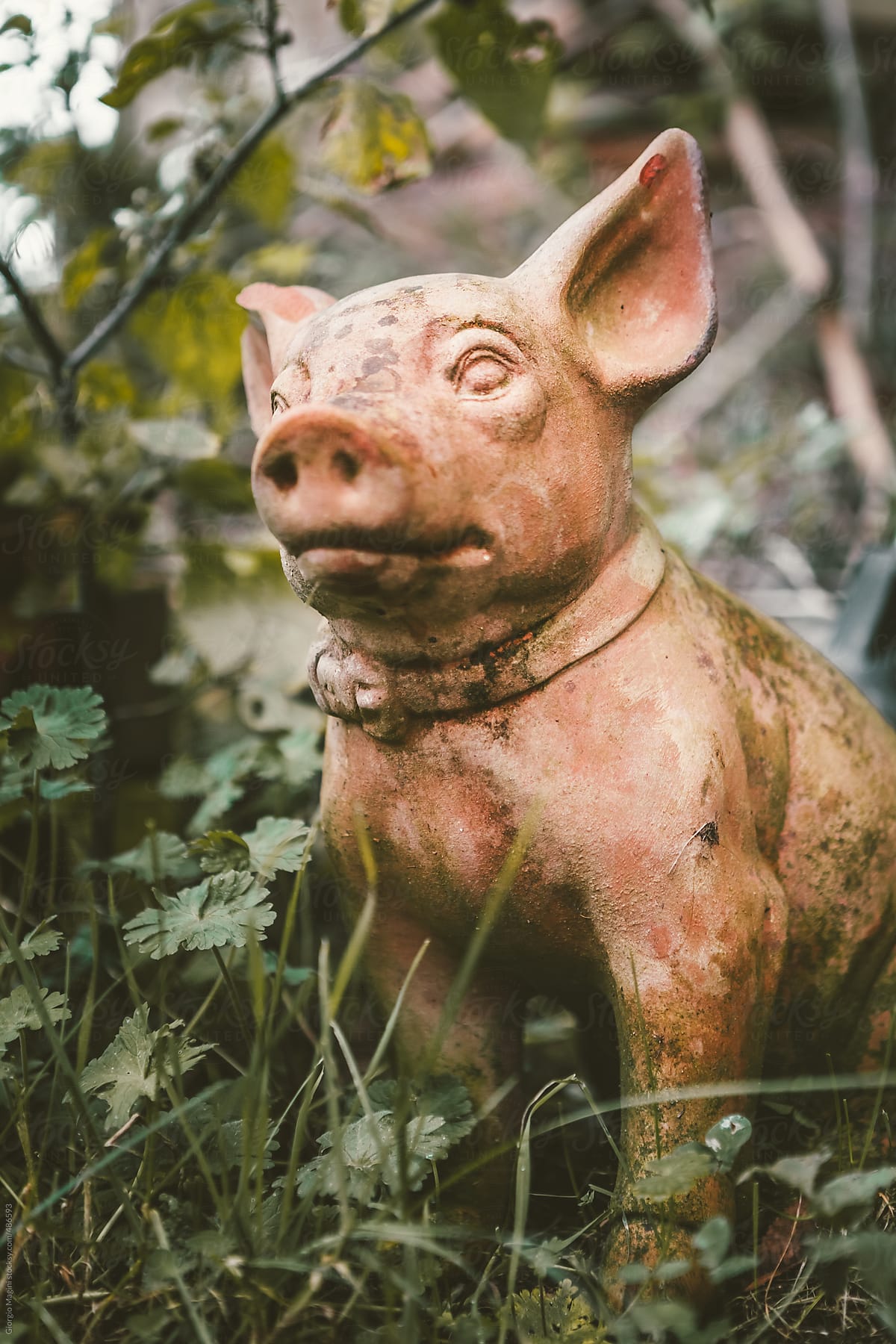 Ceramic Statue of a Piglet in the Garden