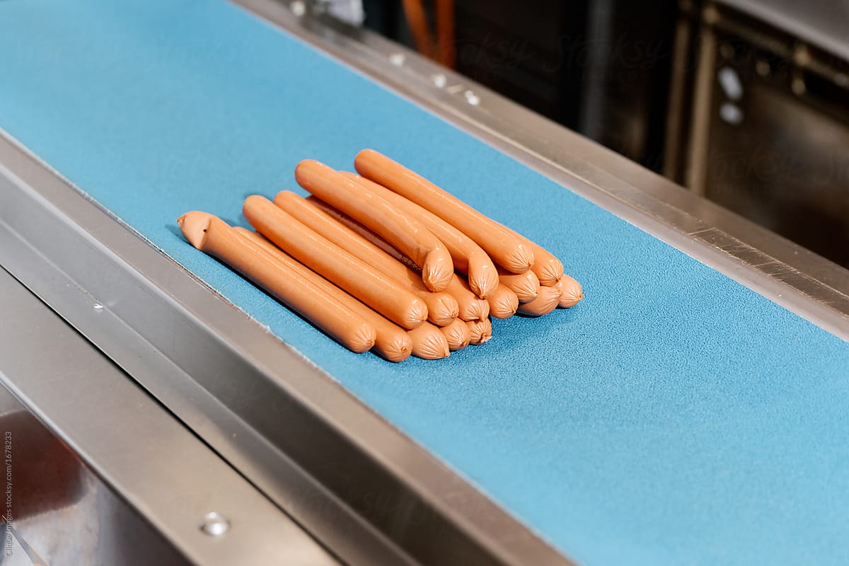 Sausages on conveyor