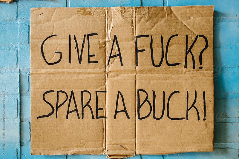 Give a Fuck / Spare a Buck hand written sign on cardboard