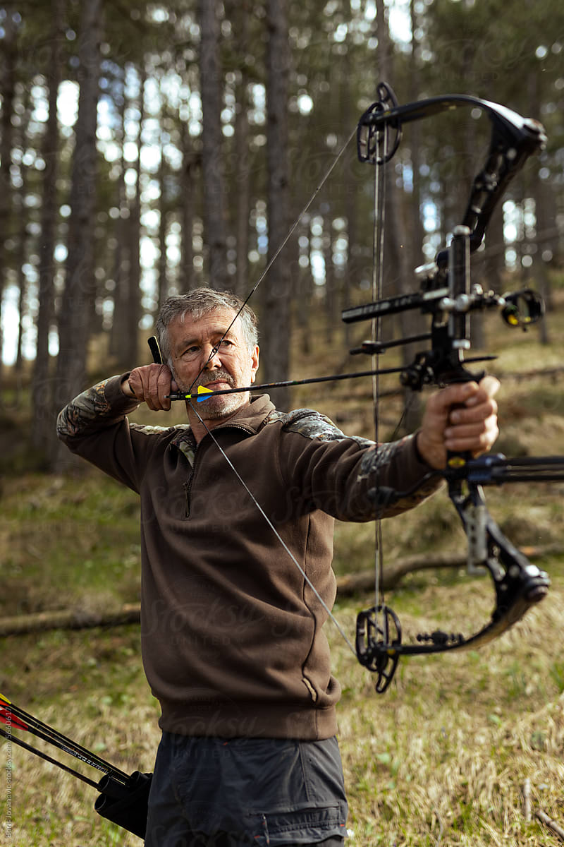 Portrait of a man practicing archery