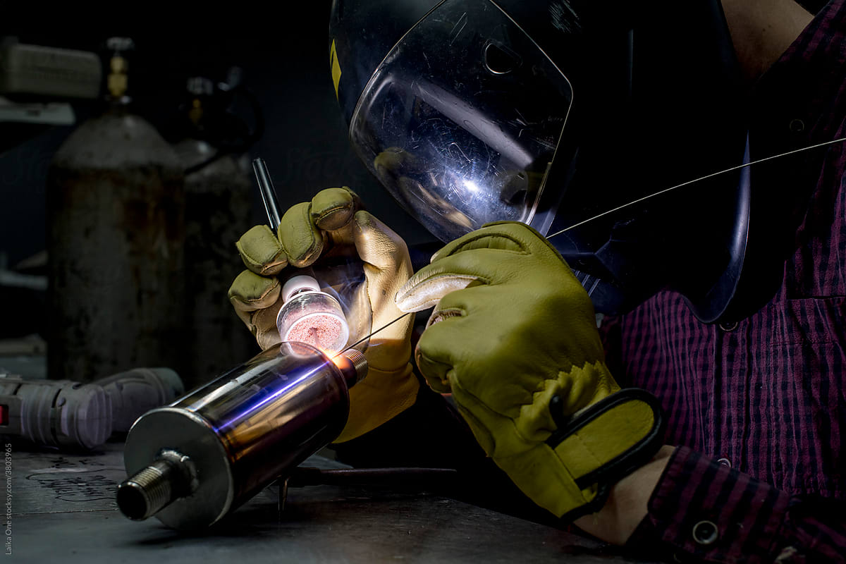 Man welding in his workshop