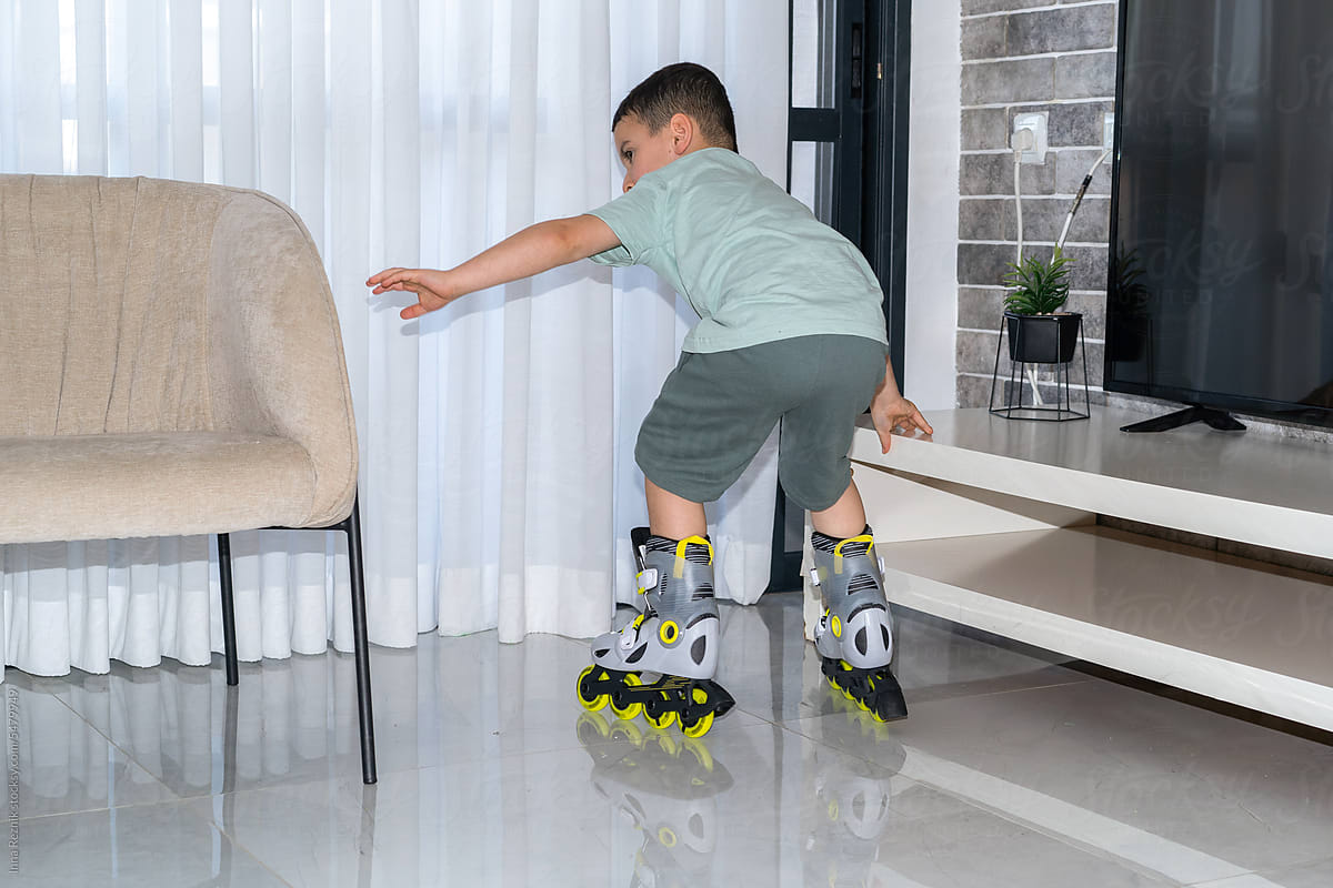 First Steps on Roller Blades - Boy Embarks on Sports Milestone.