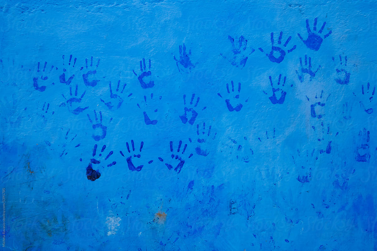 Blue wall with painted hands