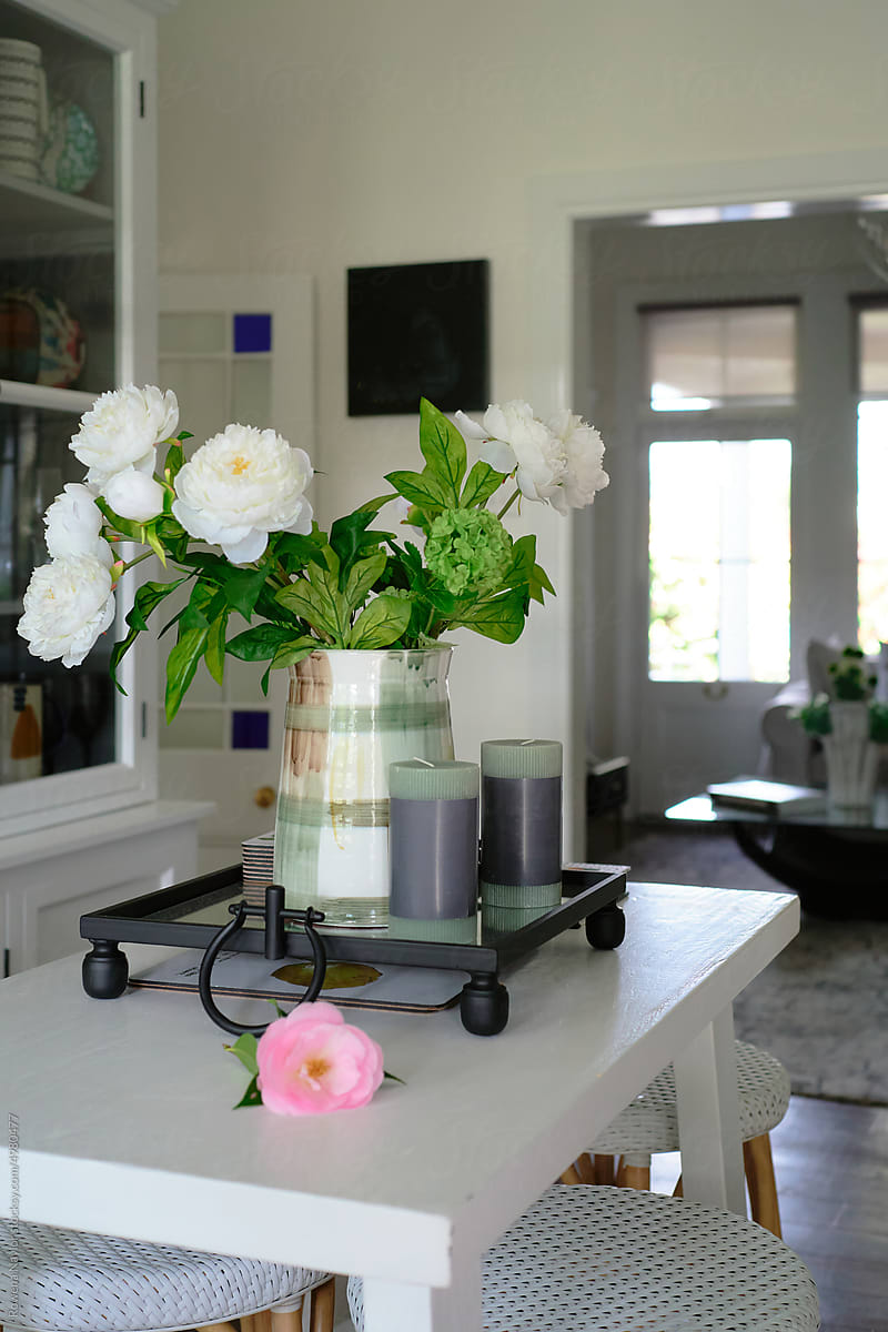 Styled decor on kitchen island bench in country home