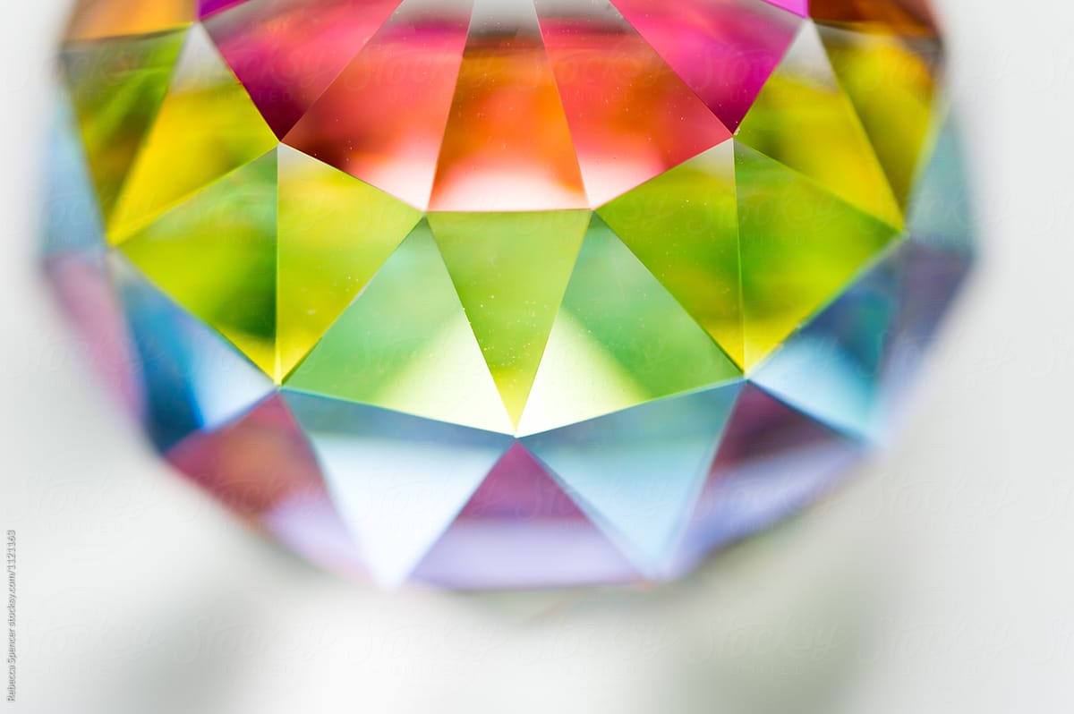 Colorful crystal reflecting light on a white background