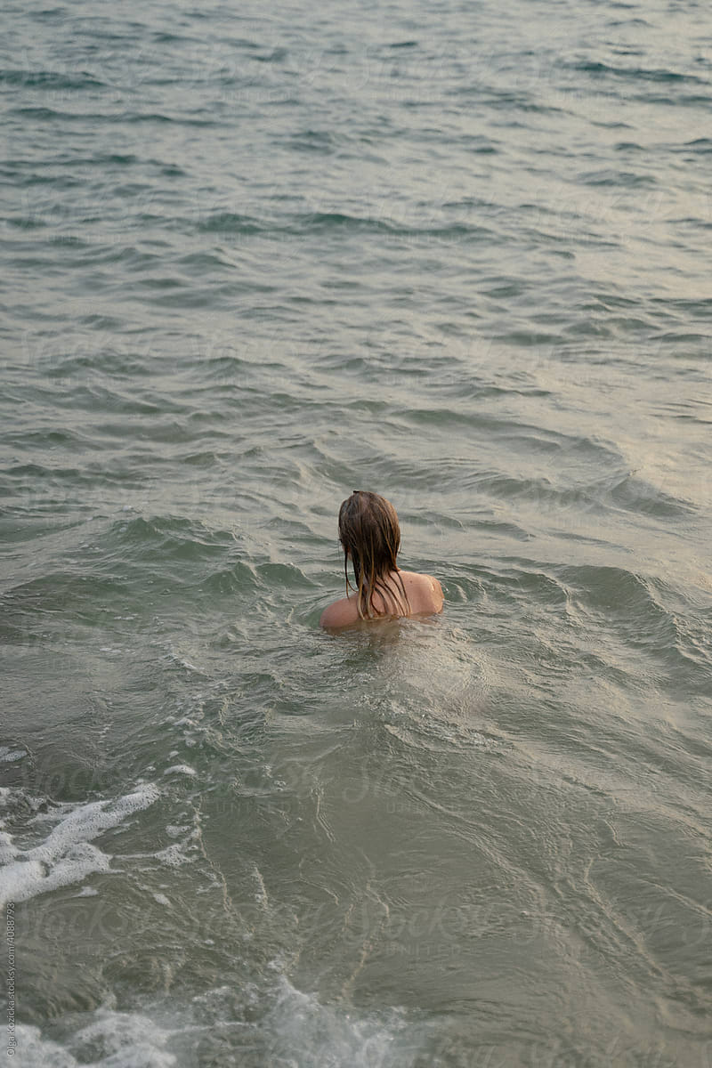 Wet Woman In Underwear Sitting By The Sea by Stocksy Contributor Olga  Kozicka - Stocksy