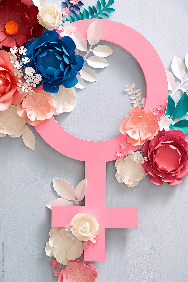 Gender symbol frame with colorful paper flowers. Flat lay.