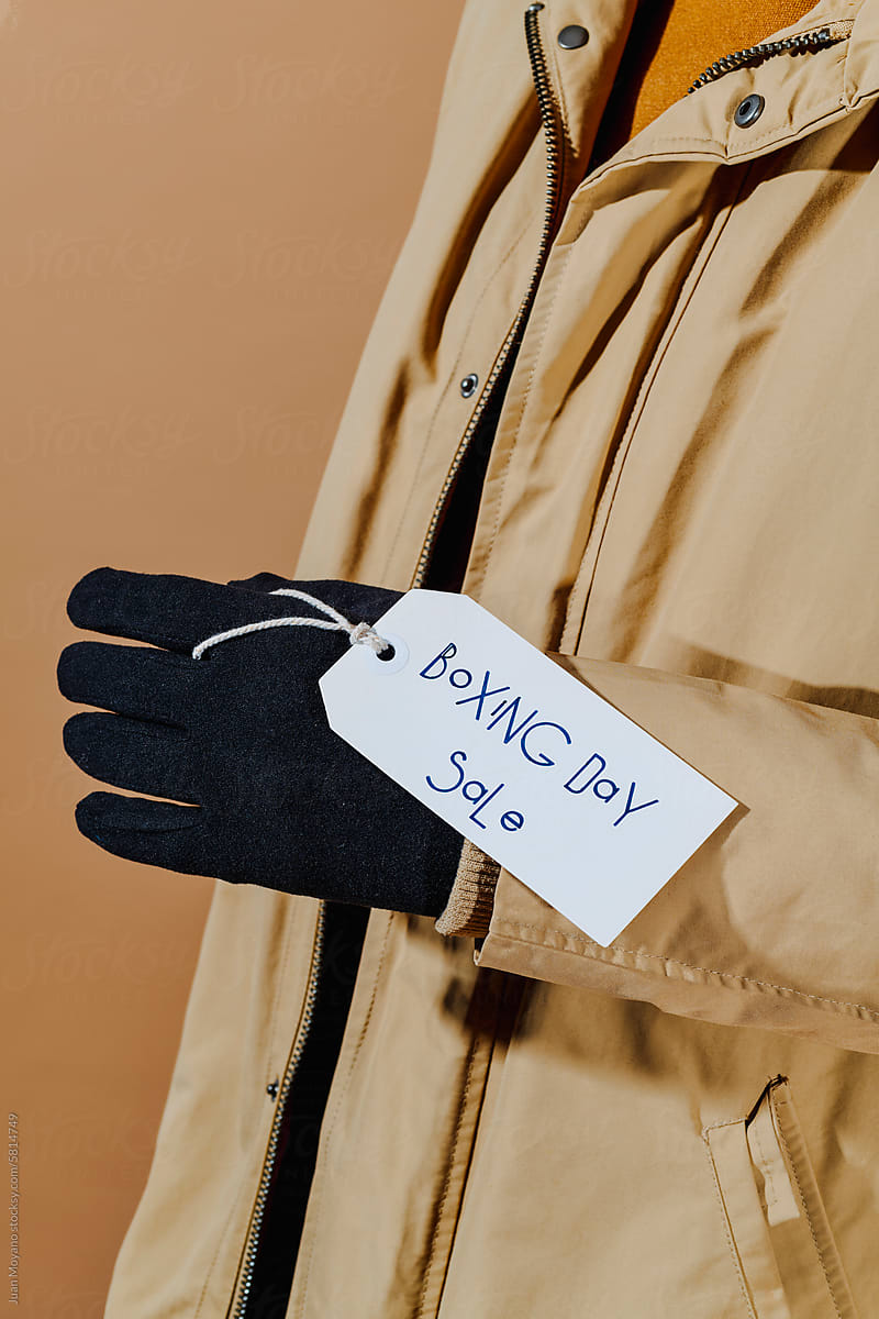 label with the text boxing day sale hanging from a glove